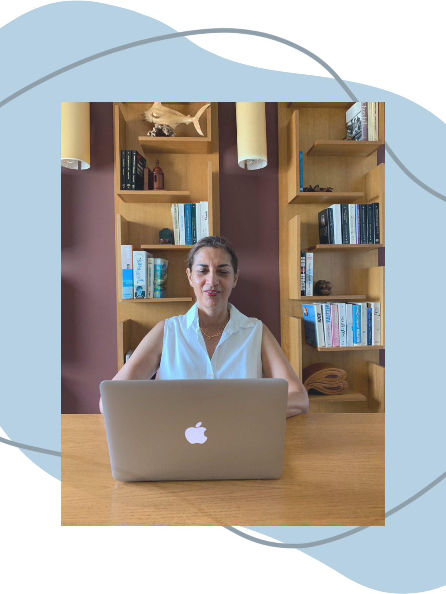 Maggie Franco, Emotional Intelligence Coach, working on her laptop in a calm office space, supporting women in building clarity and confident communication.