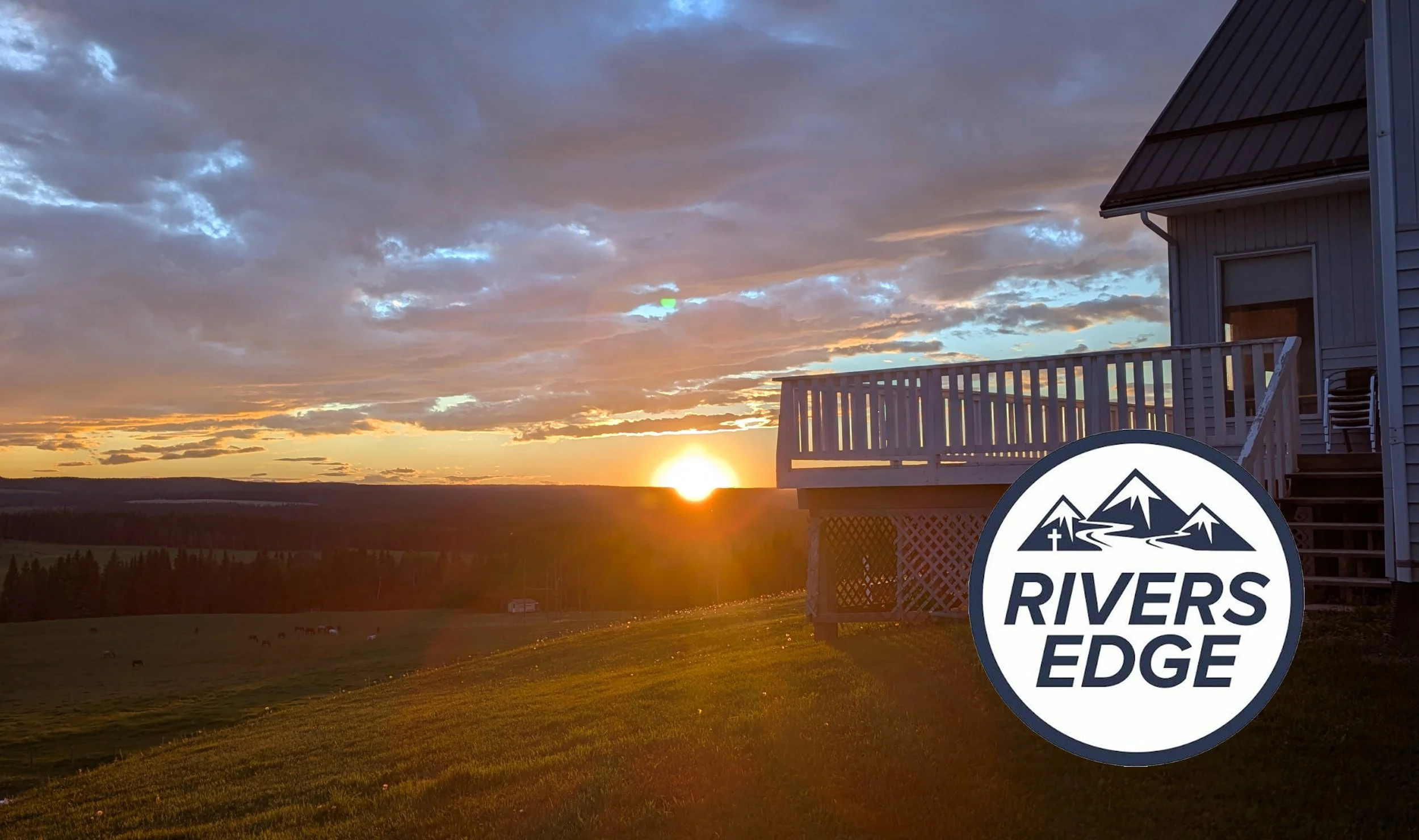 Recreational logo with mountains and river for Rivers Edge, placed over a forest river scene.