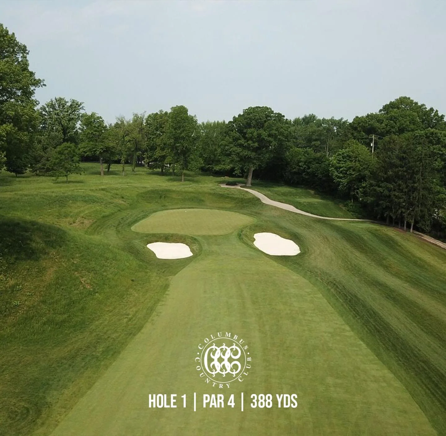 A strong start begins with precision.

Hole 1 at Columbus Country Club rewards a well-placed drive to the right-center of the fairway, setting up a full approach into an elevated green guarded by bunkers. From there, a confident swing is required&mda
