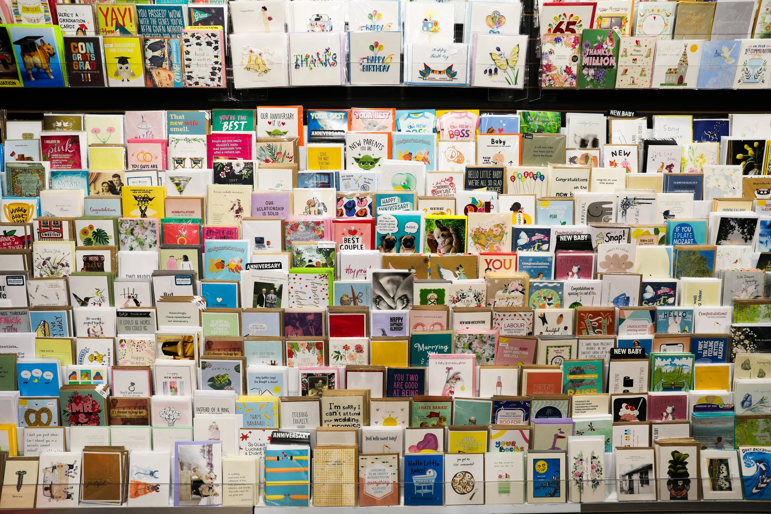 A full photo of greeting cards and birthday cards in all different designs.