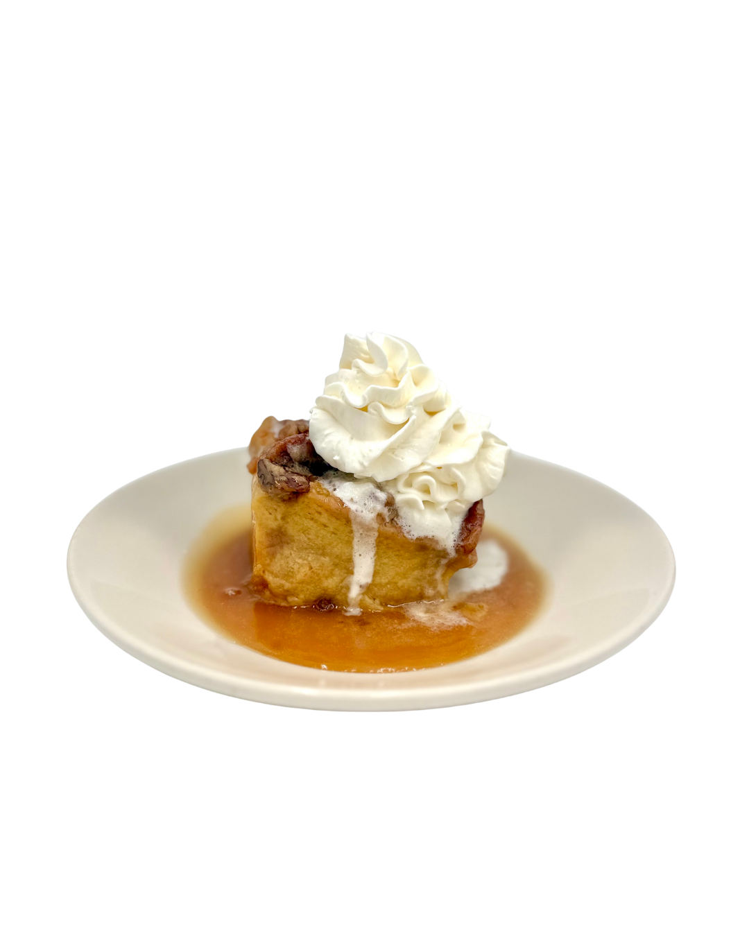 Bourbon Pecan Bread Pudding covered in bourbon toffee sauce and whipped cream