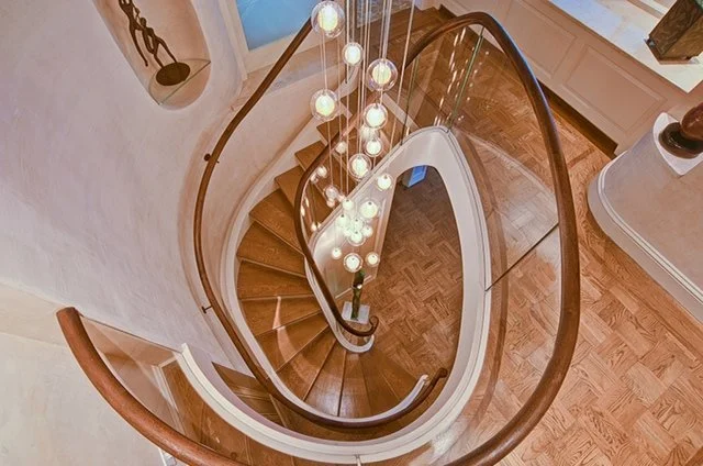 Custom Freeform Stair Linking Duplex Apartment Floors