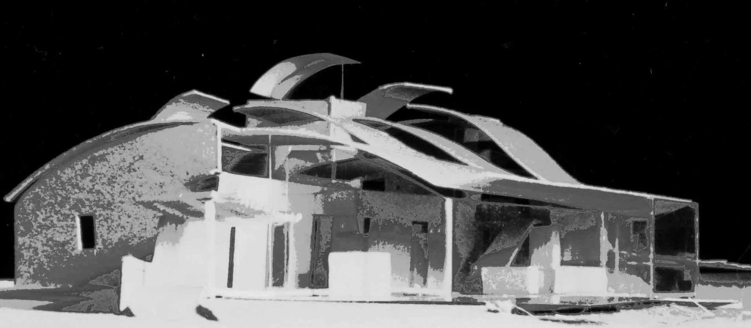 A sketch model of a modern house with unique curved roof structures, seen at night against a dark sky.