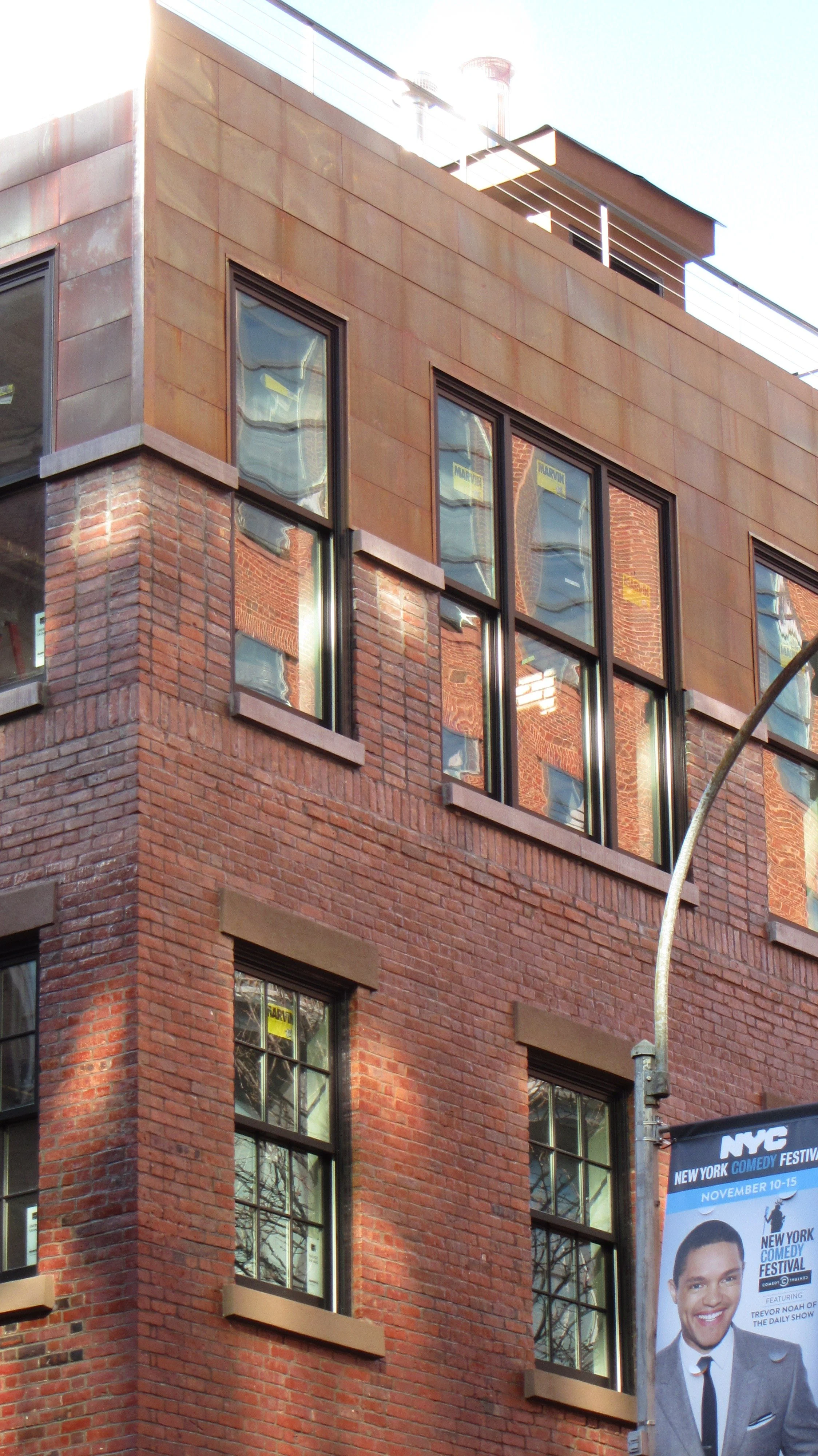 West 3rd Street Facade showing Transition from Old Brick to New Copper Cladding