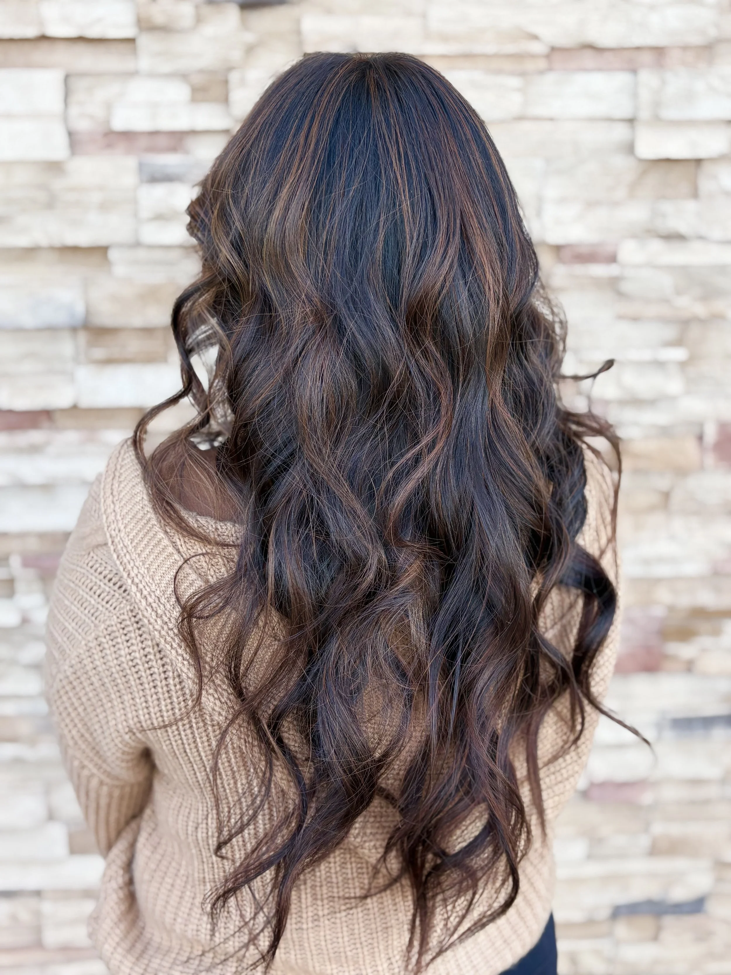 Salon customer with new long natural braids