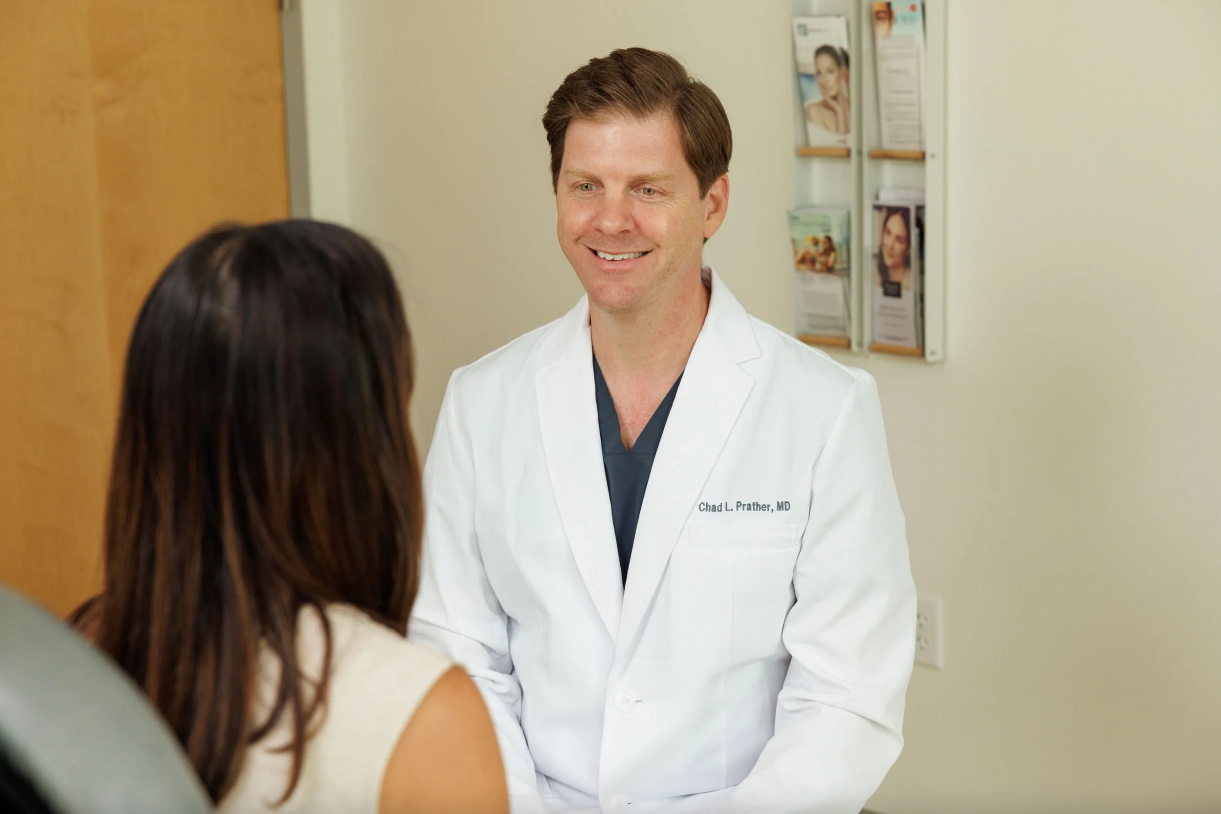 Dr. Chad Prather consulting with a patient at Derma in Baton Rouge