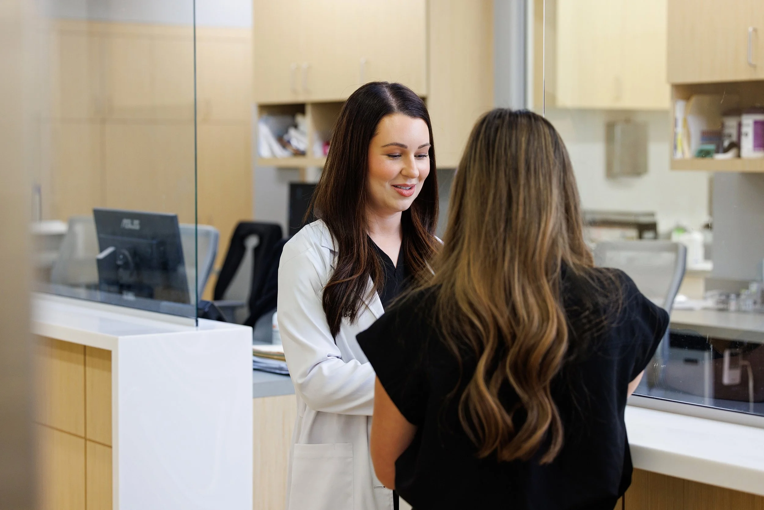 Patient checking in at the Derma front desk