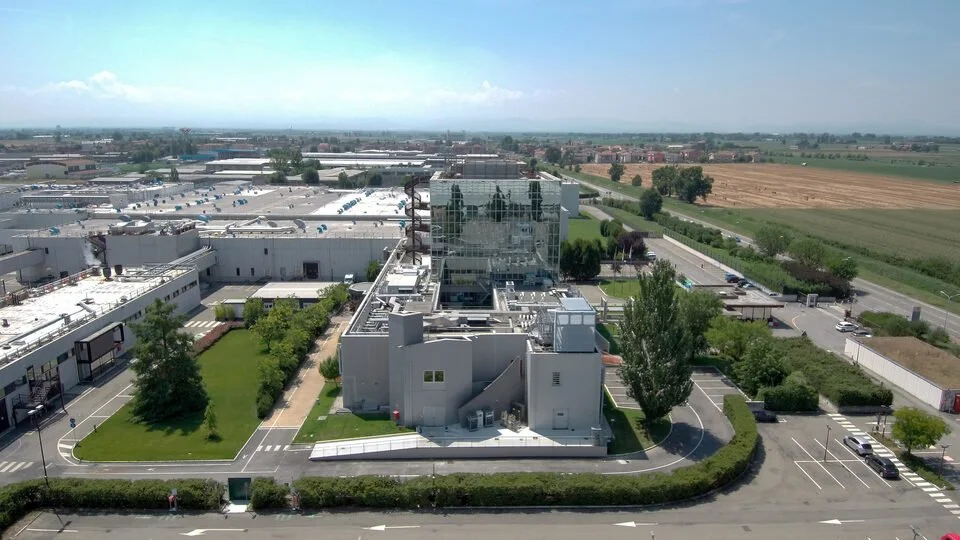 GSK Attachment Inhibitor Facility — Aerial Campus View with Glazed Atrium, Parma