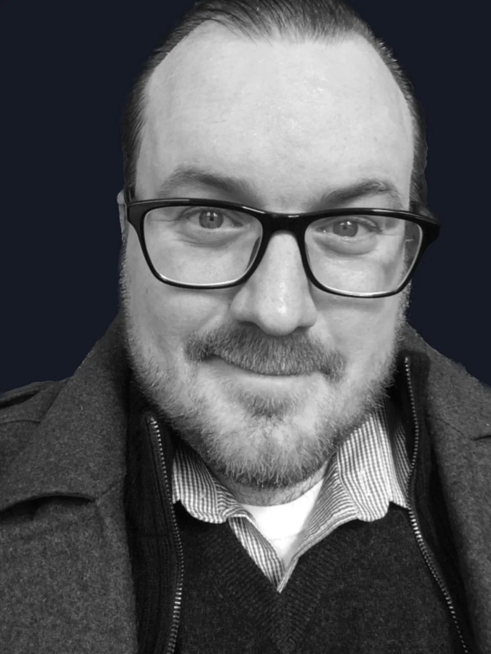 Man with mustache and light beard wearing glasses