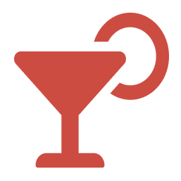 Icon of a cocktail glass with a circular garnish or stirrer.