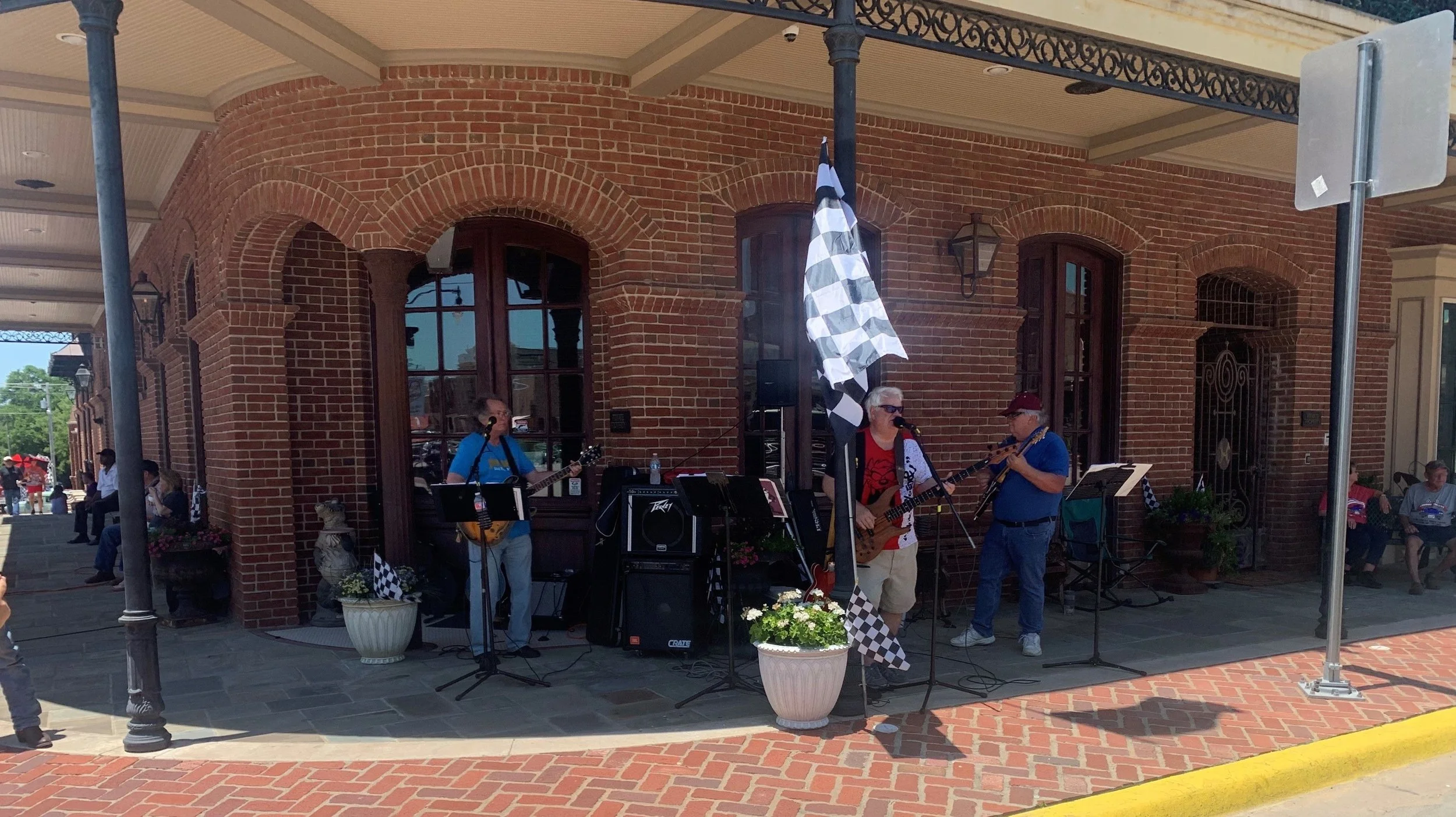 image of band playing outdoors under porch