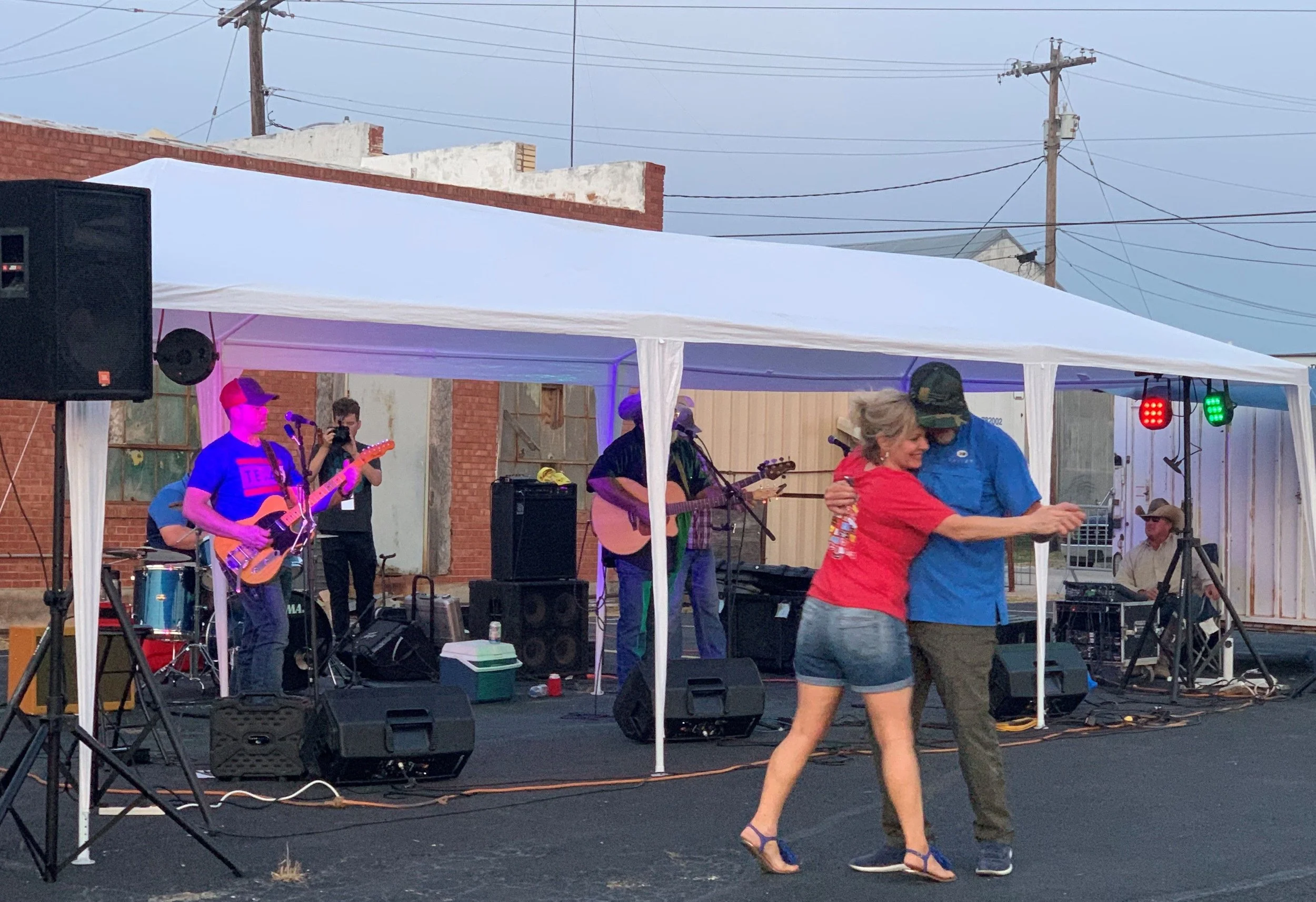 image of two people dancing in front of band