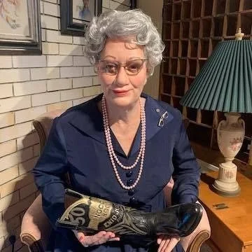 image of woman holding boot