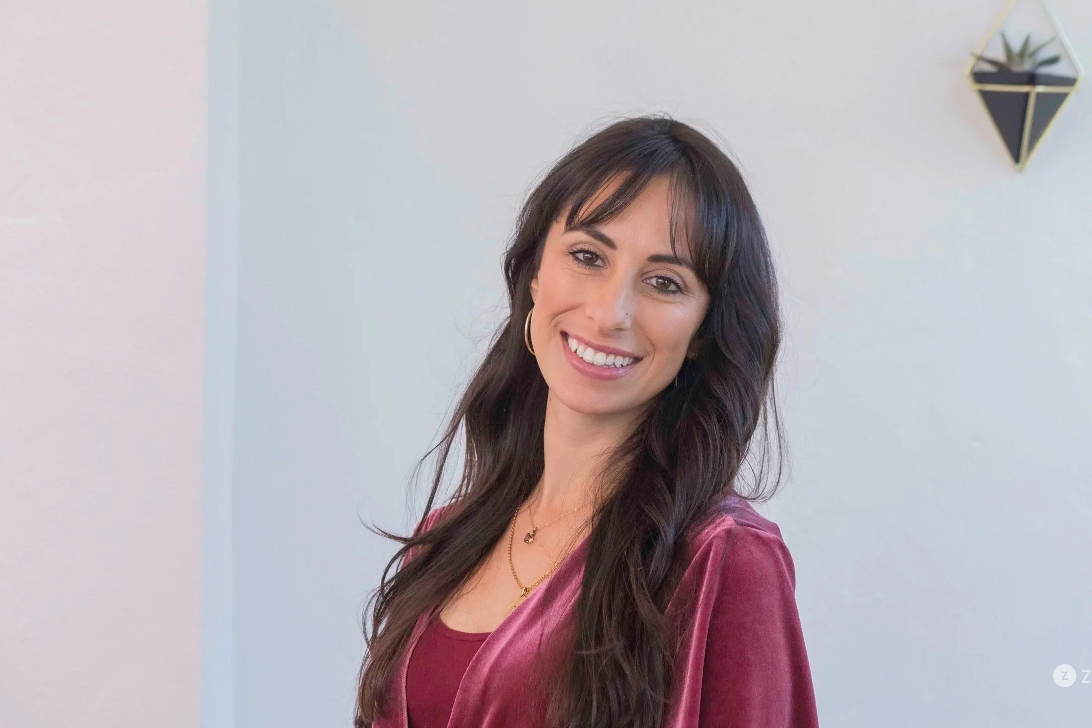 eating disorder treatment therapist in san diego long brown hair, smiling, burgandy top