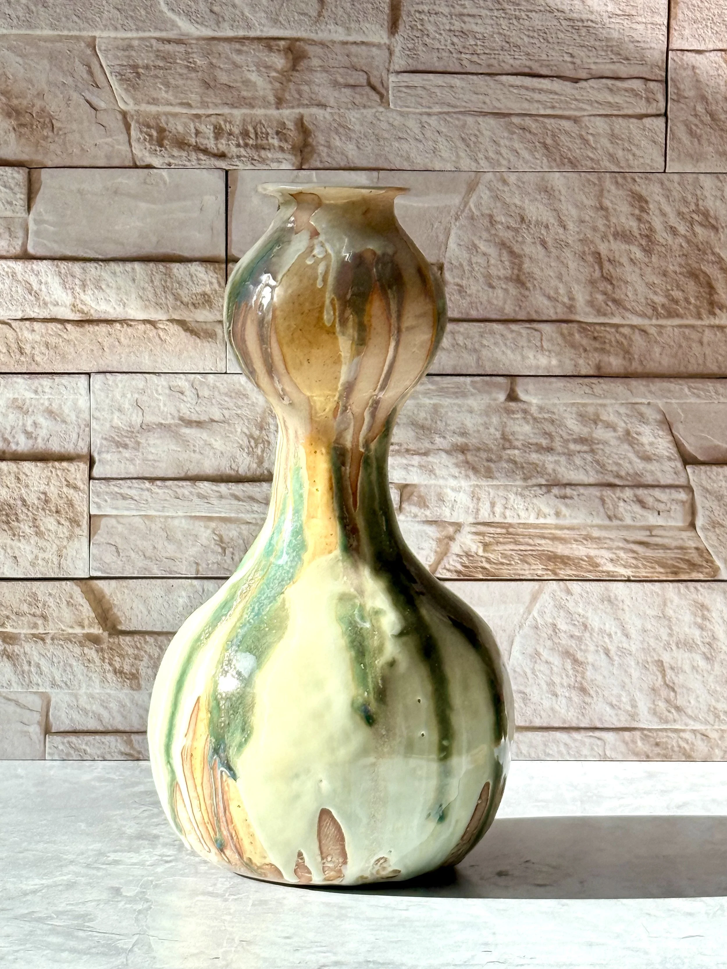 ceramic vase fired in gas reduction glazed in three glazes.