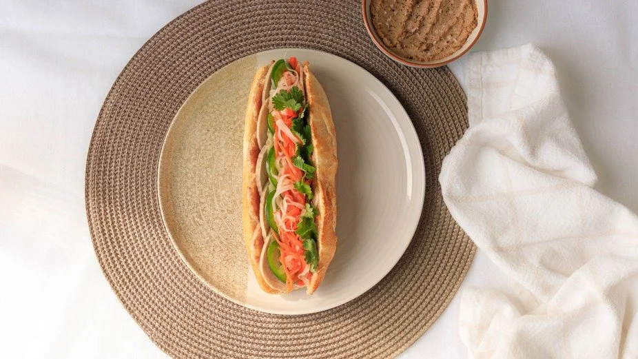 Relish the fresh and irresistible flavors of our Vietnamese sandwich with vibrant ingredients. 🌿 #BanhBo #NewarkEats #VietnameseCuisine #BanhMiMagic #QuickBite