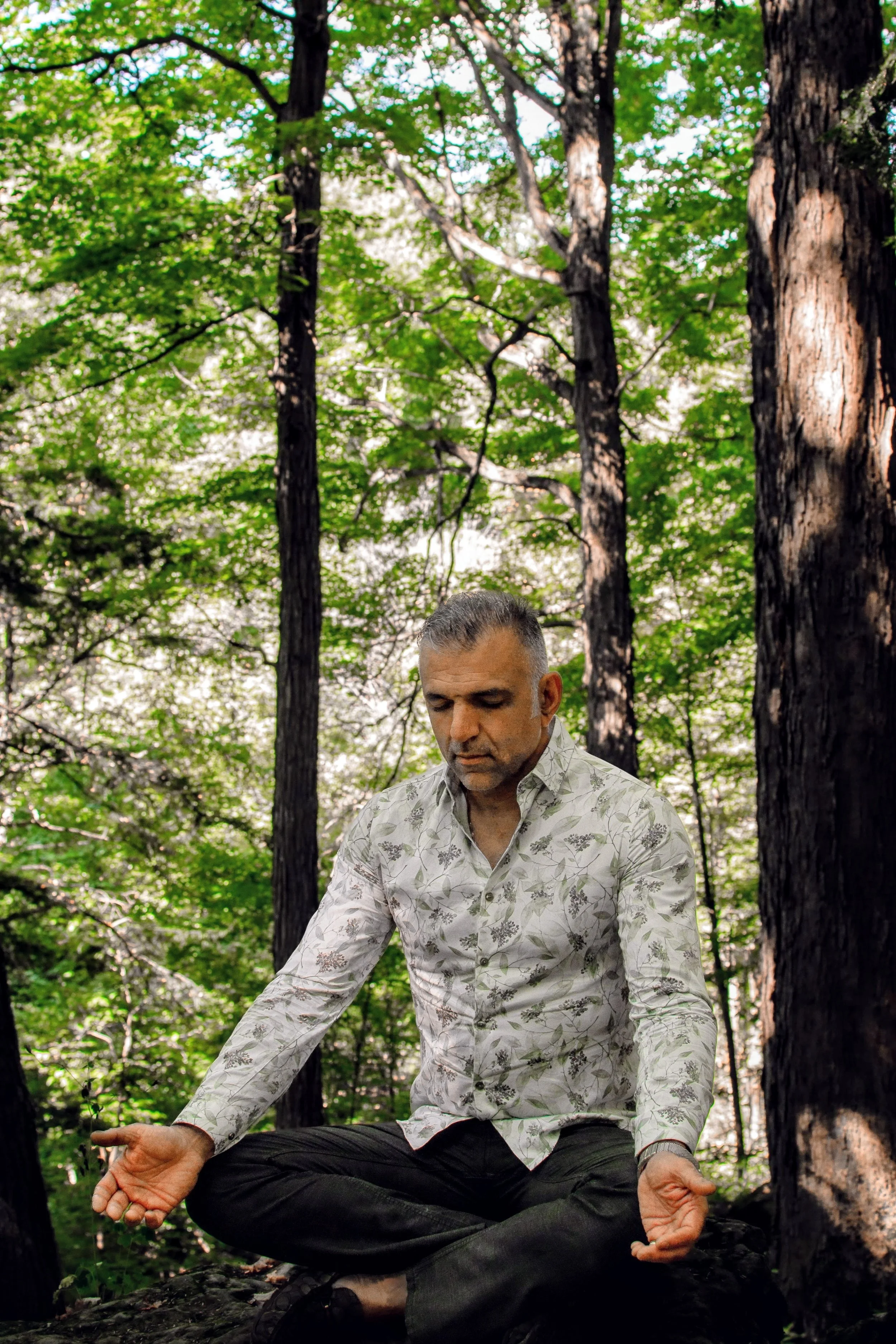 Alex Nikousefat practicing mindfulness and nature-based wellness, reflecting the holistic healing philosophy of HAOMA CO. Holistic Health.