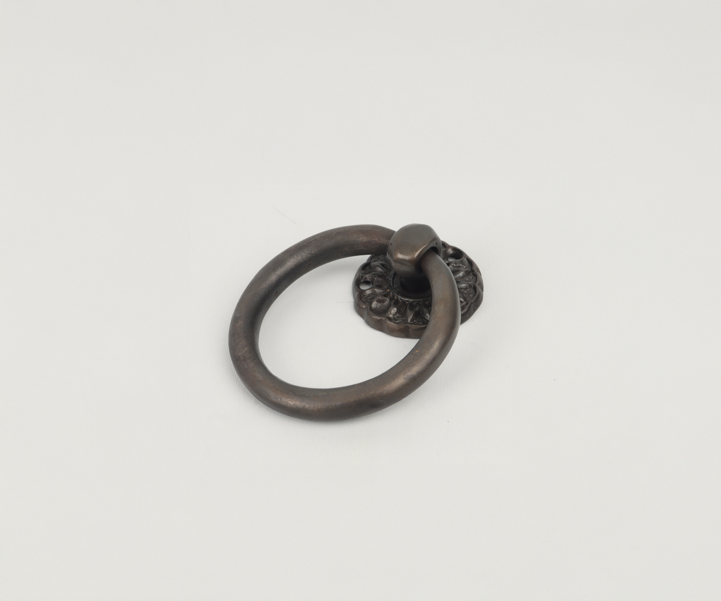 Metal door knocker with circular ring design on a plain white background.