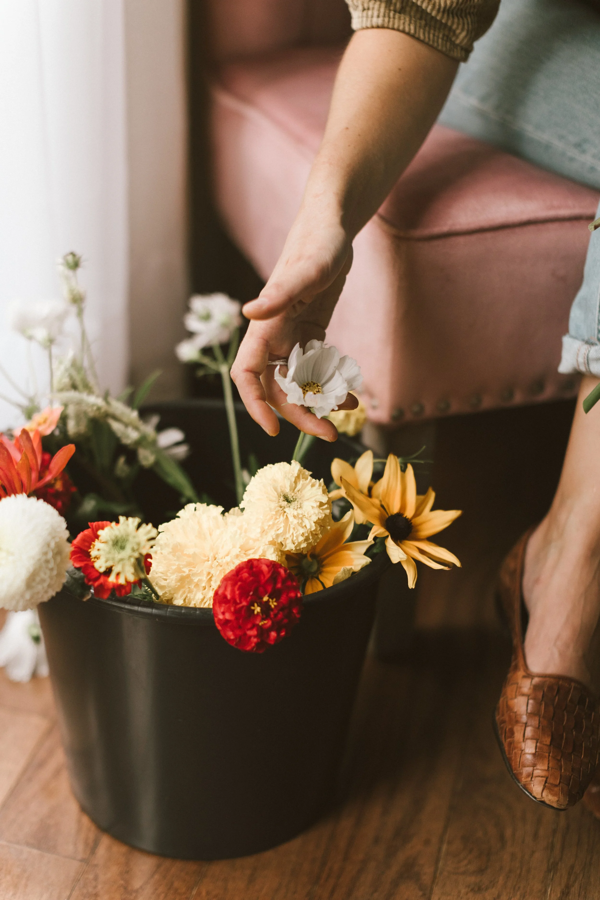 Hand picking flowers for interior floral styling, photo by Linnea Marie Photography