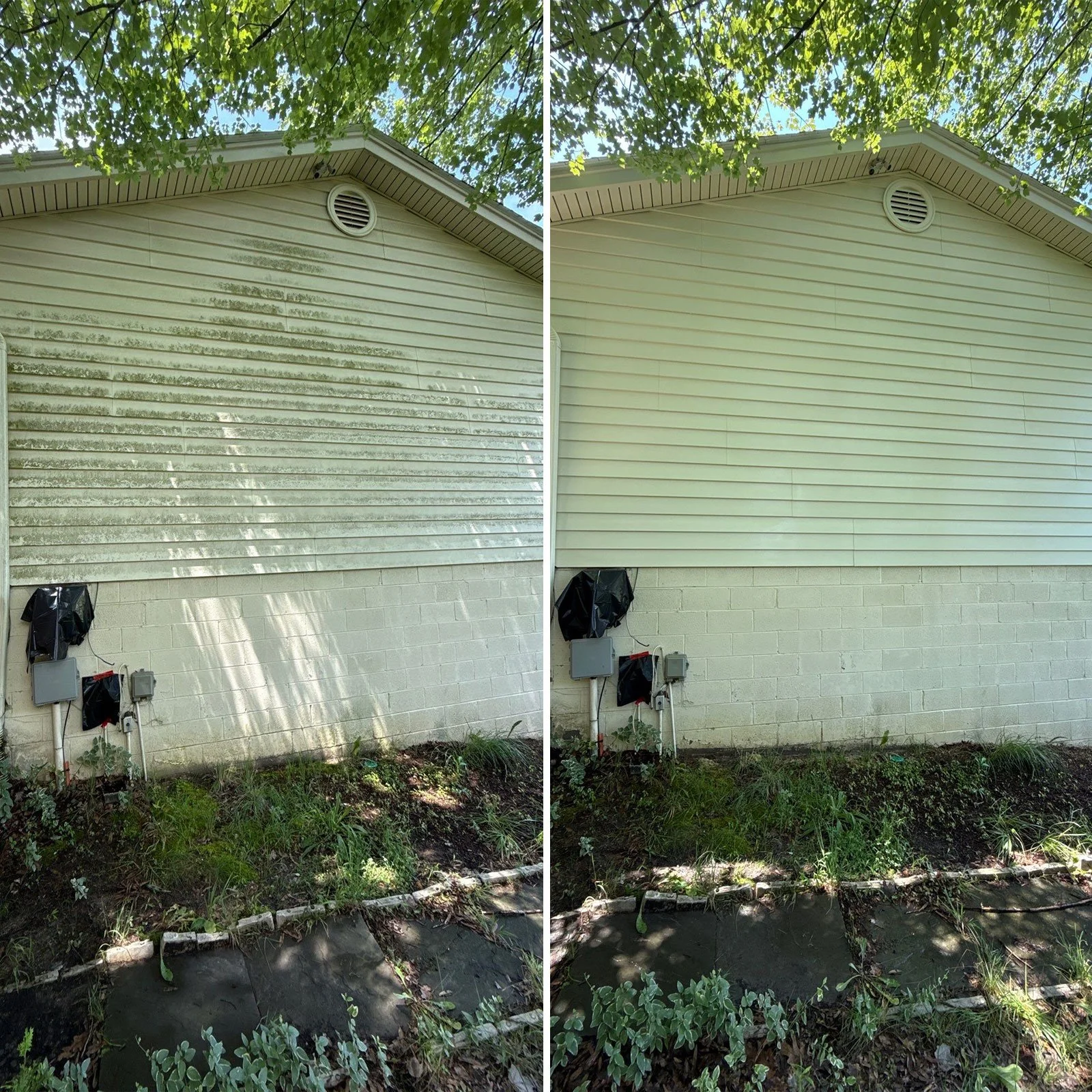 Side of a house with weathered beige siding on the left and clean beige siding on the right, with electrical boxes and a garden bed in front, beneath a tree with green leaves.