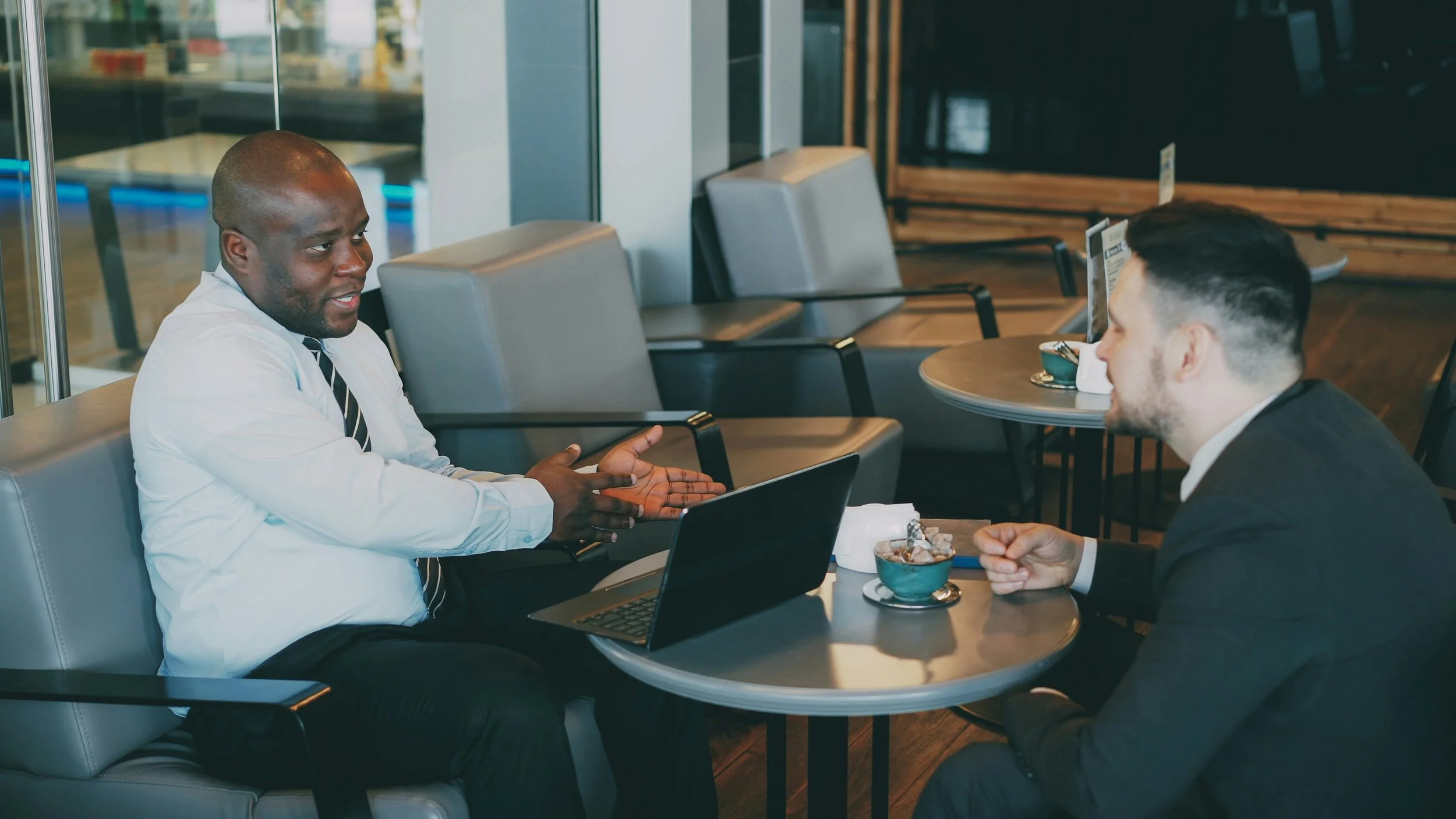 Business professional meeting with an international counterpart in a corporate setting