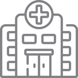 Outline of a hospital building with a cross symbol on top
