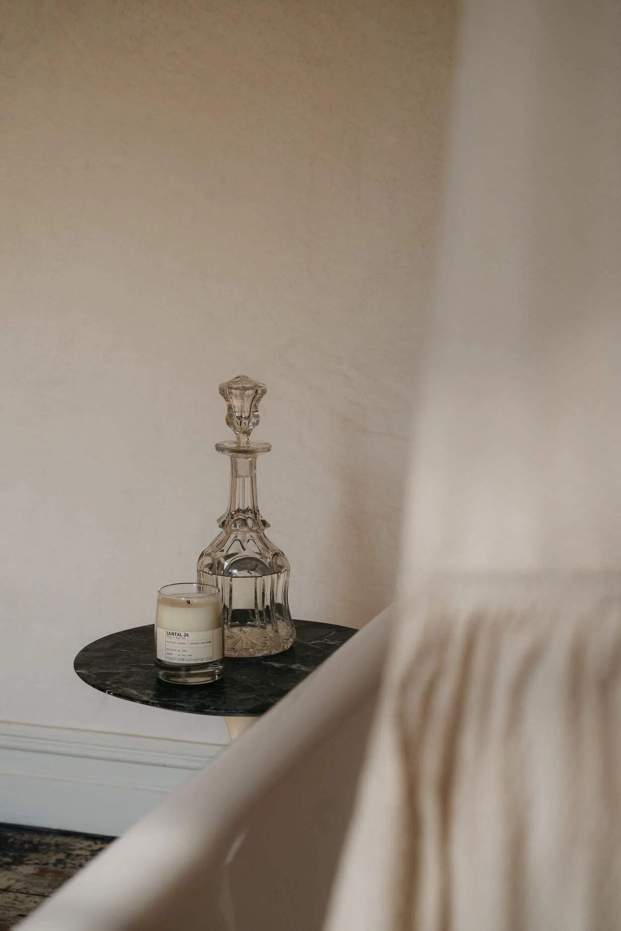 Still life detail captured in the bathroom at Sea Tower, highlighting textures of marble, glass and lime plaster, styled by Emily Chalmers for Caravan Style.