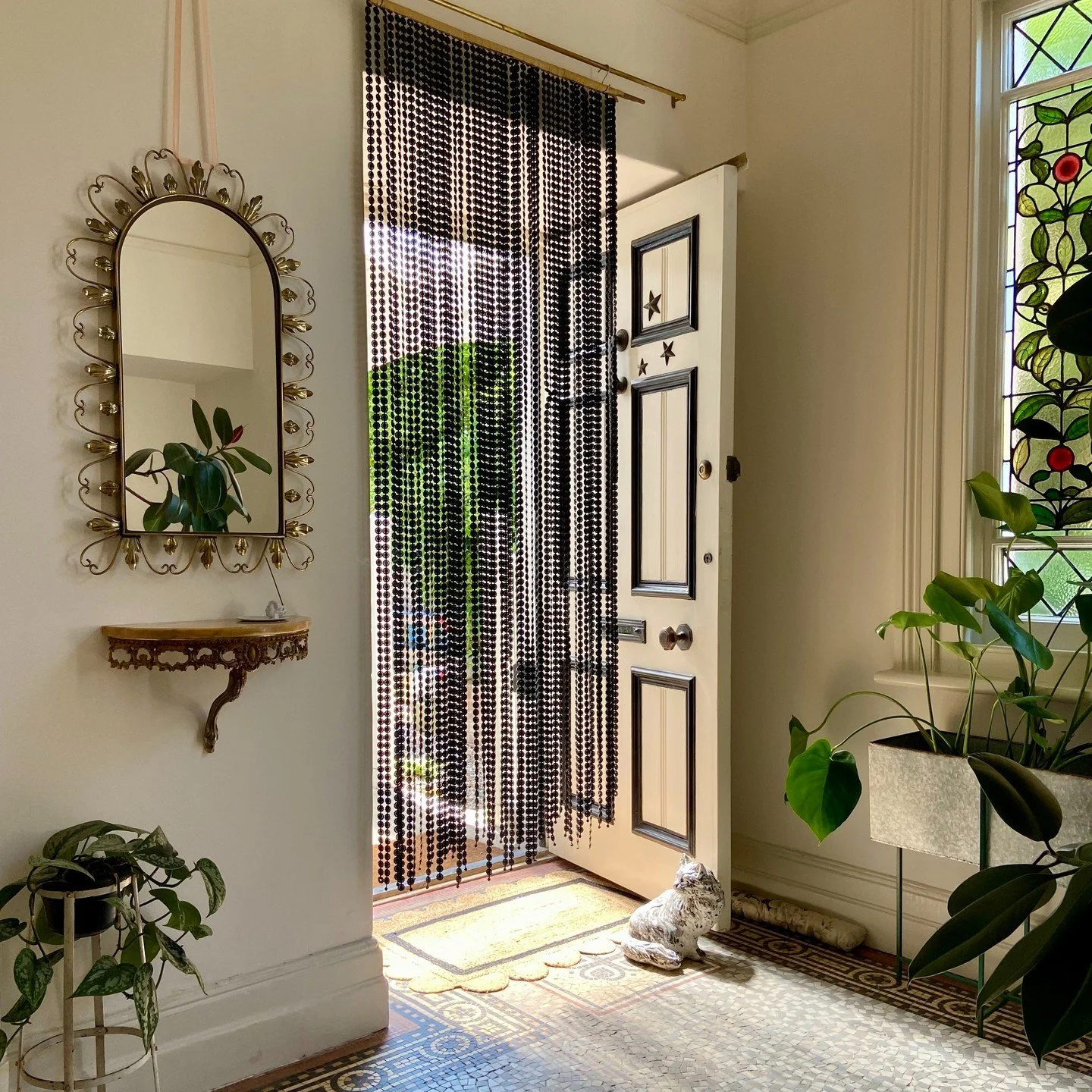 Summer at Sea Tower = me carting this plastic bead curtain around to screen the nearest doorway ⚙︎⚙︎⚙︎⚙︎⚙︎

Strings of clip-together plastic flowers hand-sewed to a length of fabric sewn around a bamboo pole. I have no idea how old this is and I'm wo