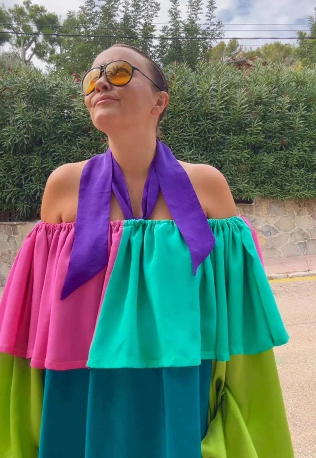 Portrait of fashion and costume designer Alexandra Mann wearing one of her own dress designs at her home on the Kent coast.