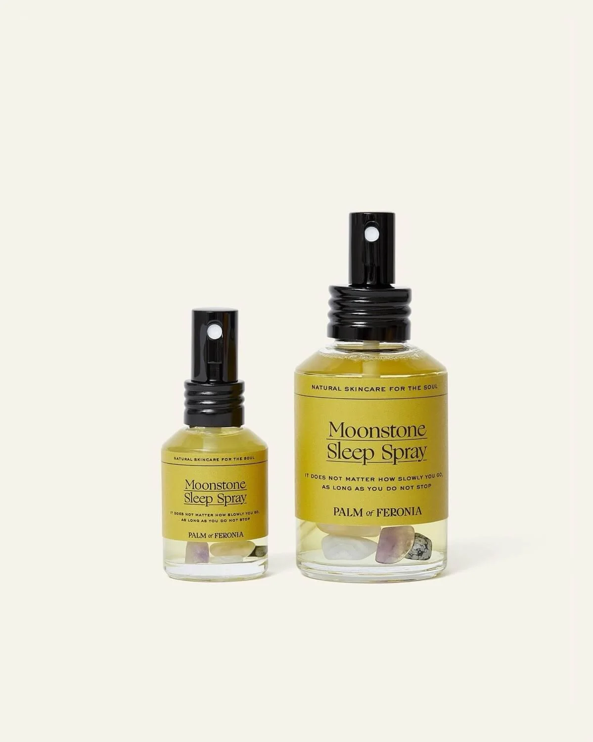 Moonstone Sleep Spray by Palm of Feronia infused with crystals in a glass bottle with spray cap.