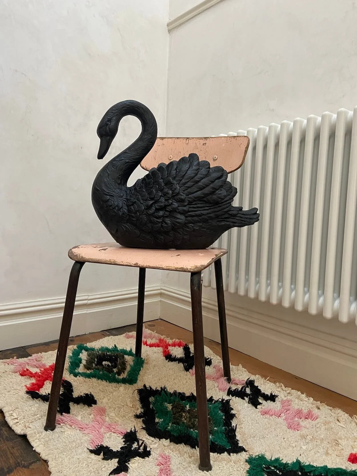 black-swan-on-chair-caravan-style.jpeg