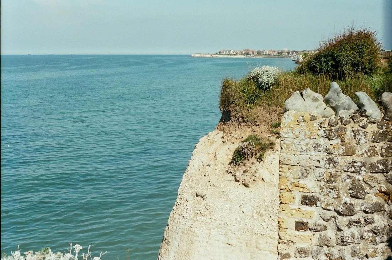 View of the chalk cliffs and blue sea from the bottom of the garden at Sea Tower on the Kent coast.