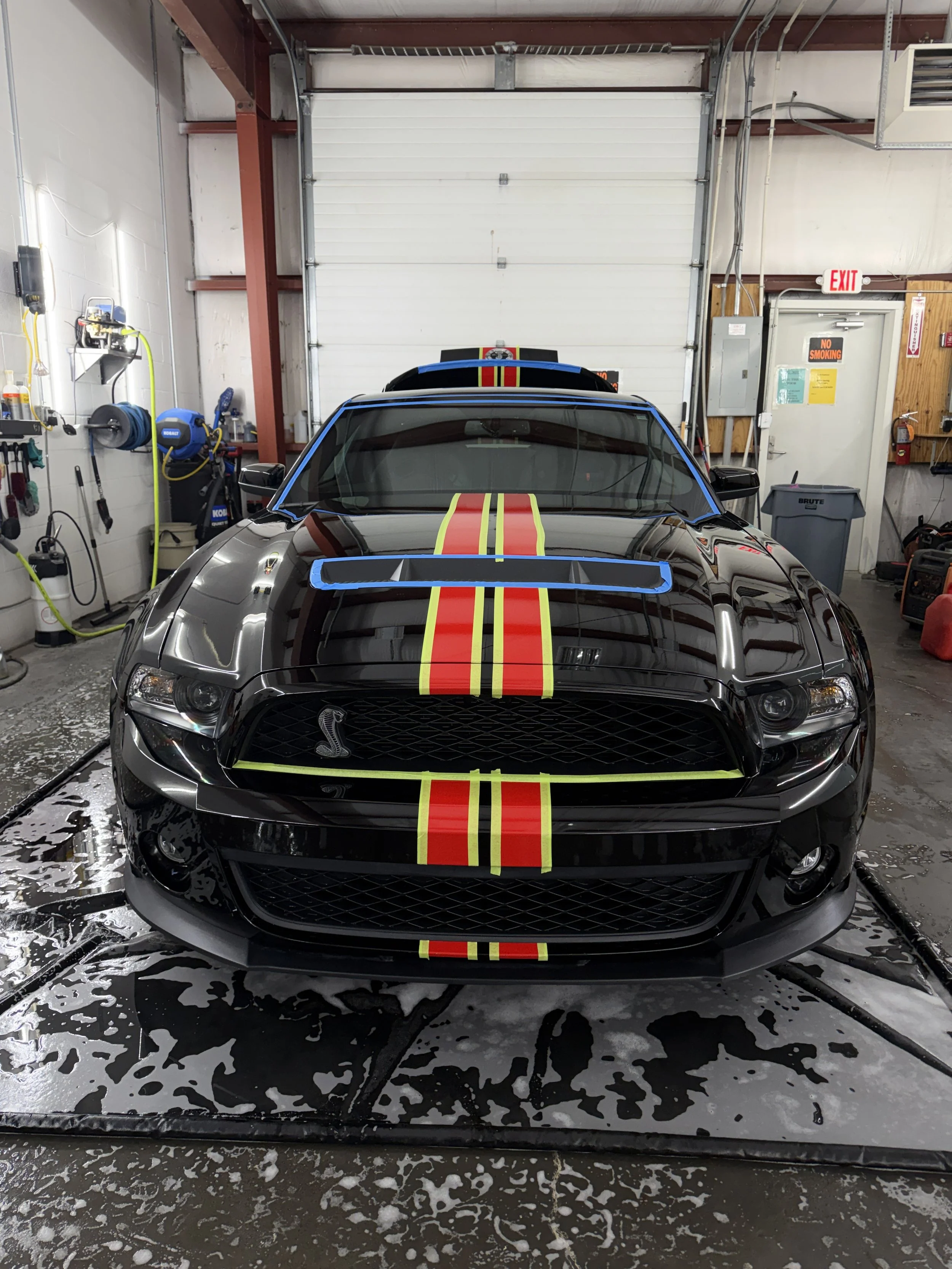 A black Ford Mustang Shelby GT500 getting prep for a 3 stage paint correction and ceramic coating.