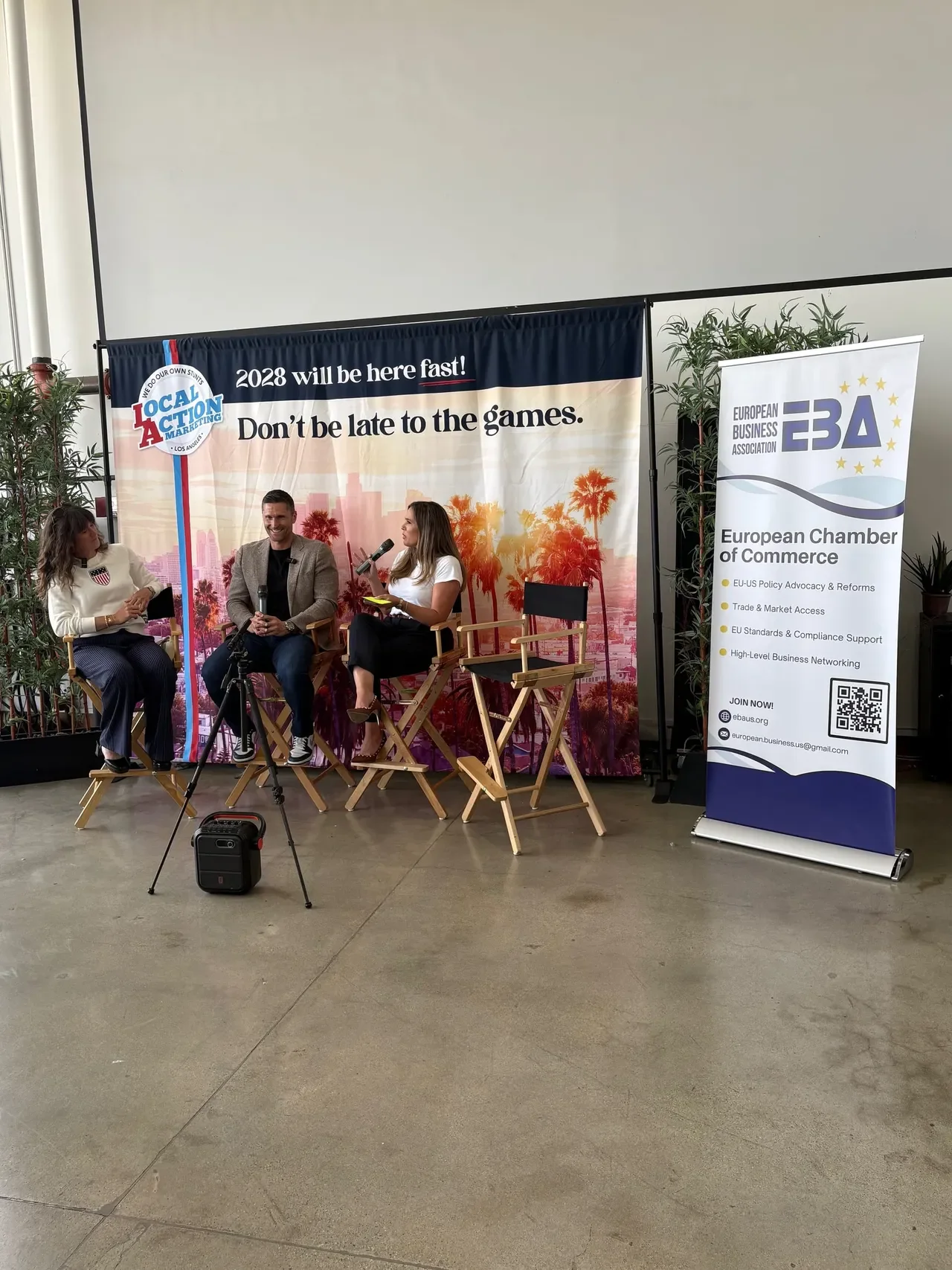 Three speakers (a Paralympic and Olympic gold medalist, along with a CBS Sports Anchor moderating)  in a fireside chat at April 16 event in Santa Monica for the international community to engage around the 2028 opportunities