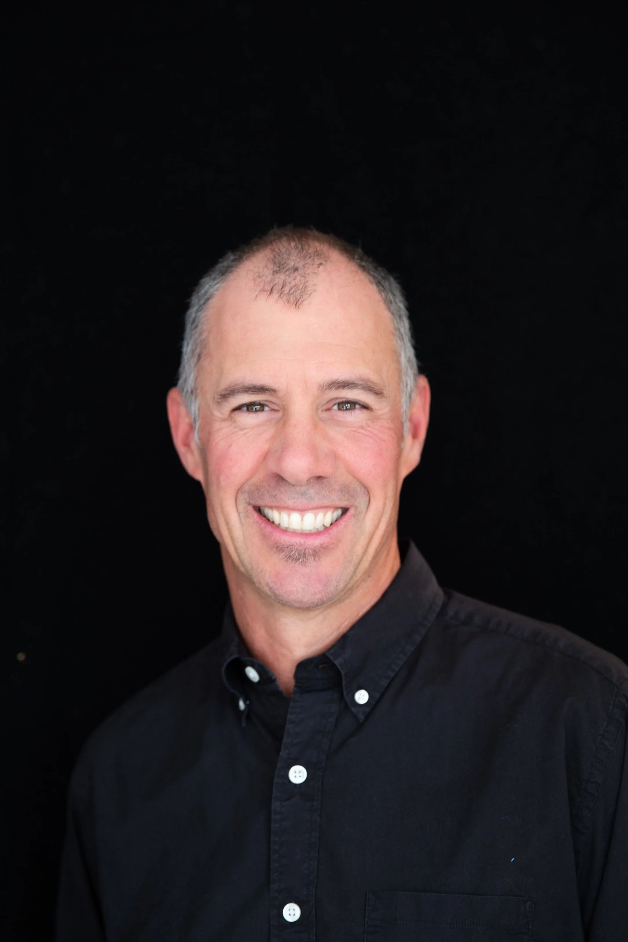 Rob Penner Headshot Black Background-1.jpg