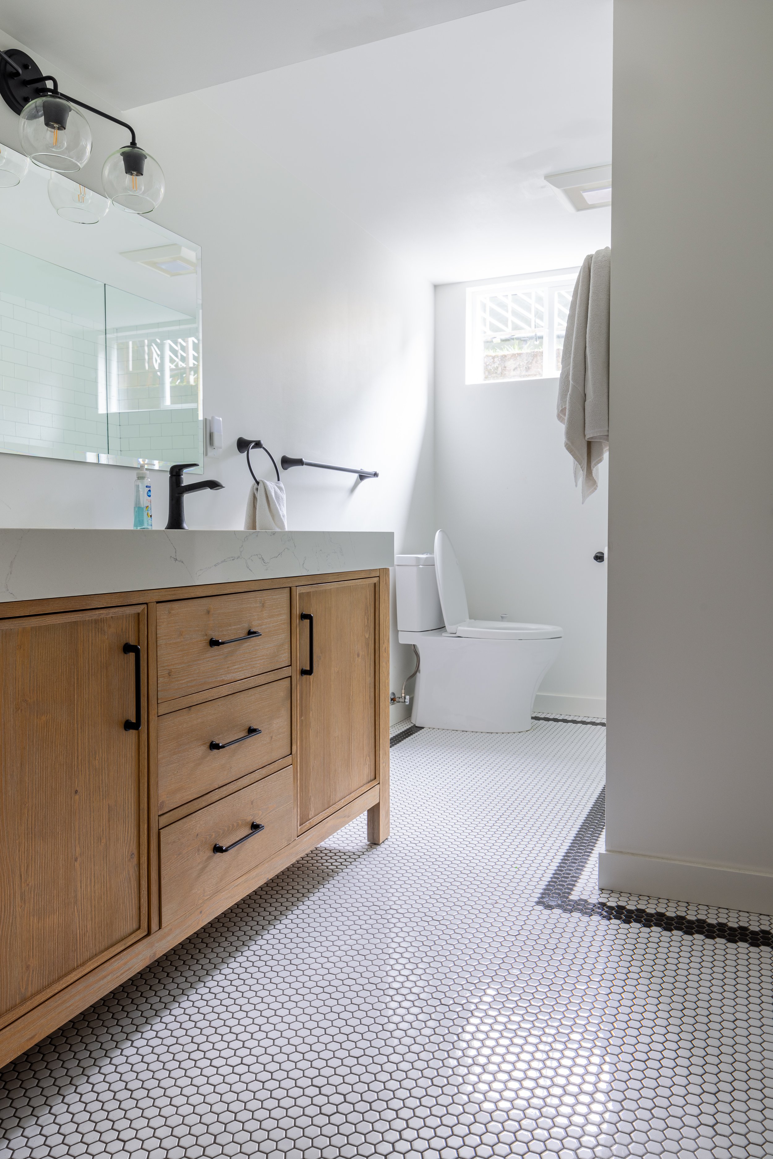 Tile floor, new vanity, beveled mirror