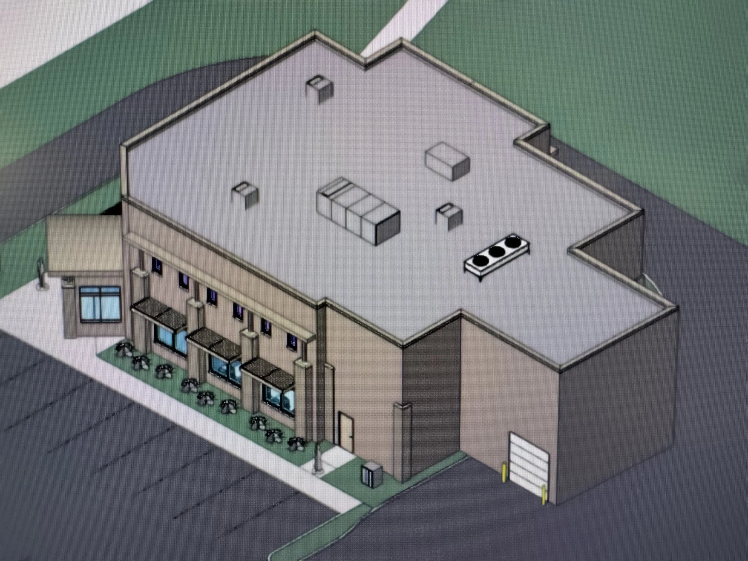 Revit BIM rendering of a two-story commercial building with mechanical equipment on the roof.