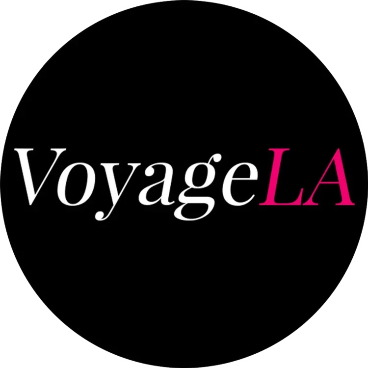Logo for Voyage LA with black background and white and pink text