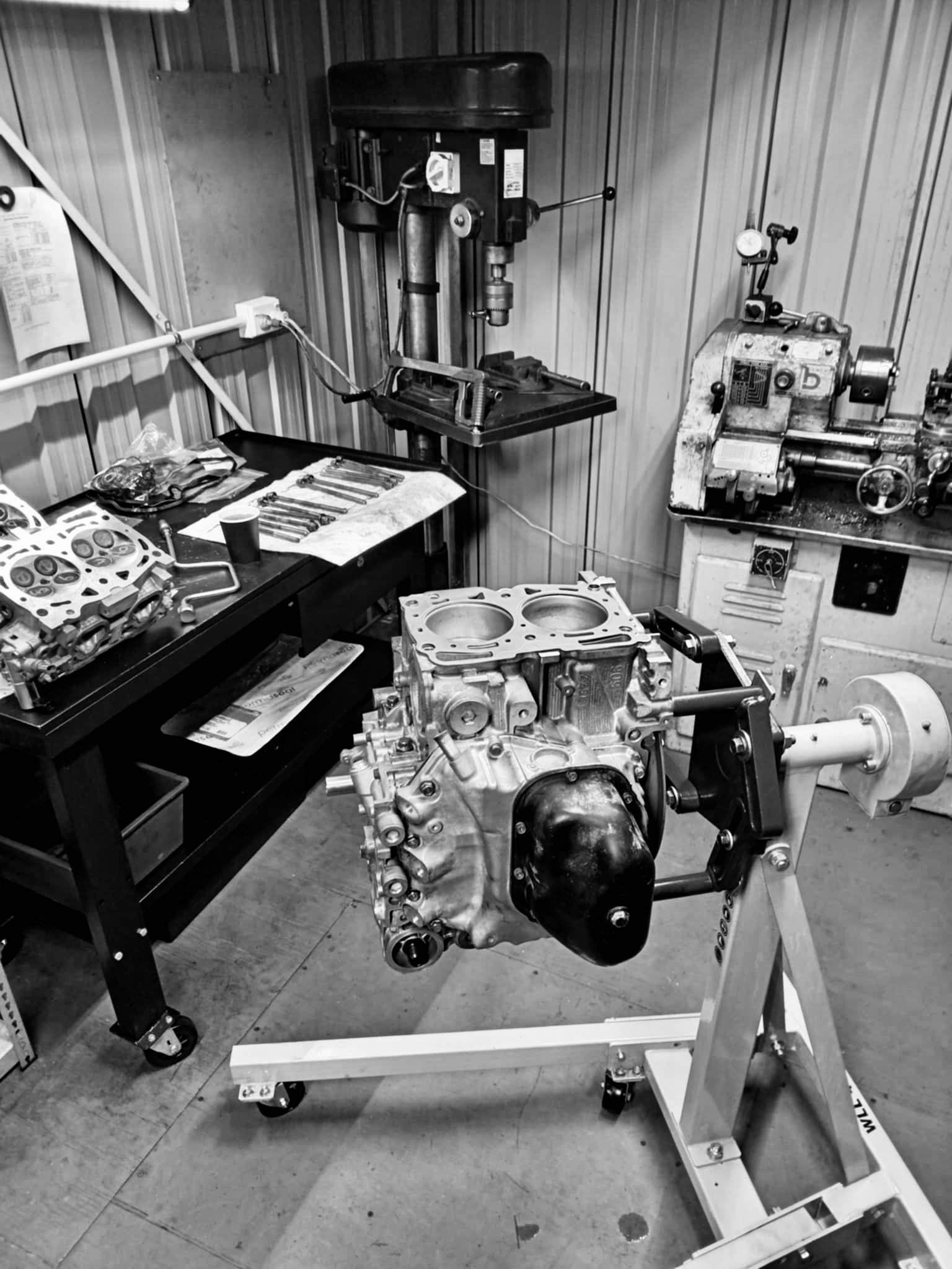 A vehicle engine in the midst of being serviced before transplanting.