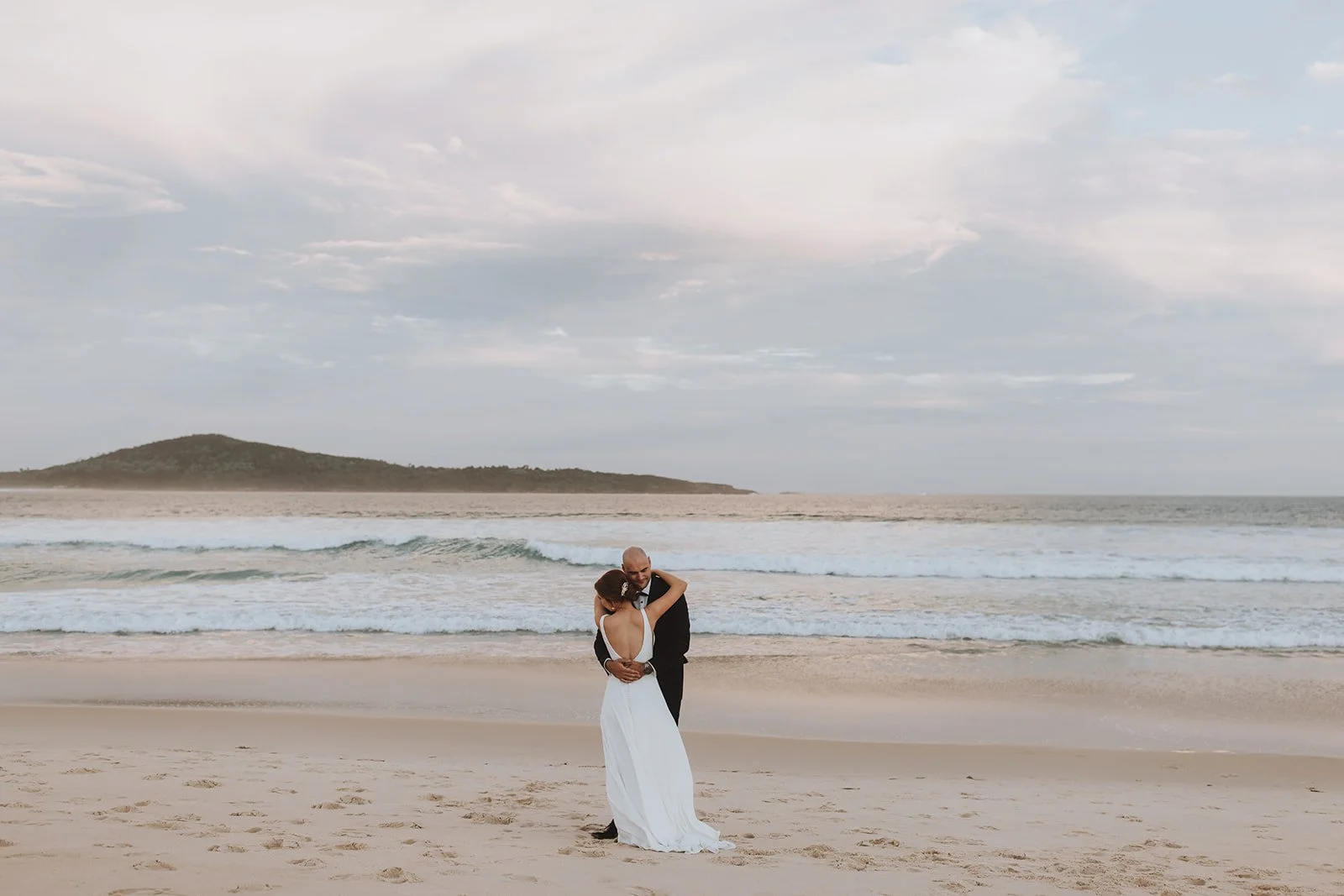 Bride and groom sharing a quiet kiss on Fingal Bay beach. Hunter Valley Wedding Photographer NSW - Image 20