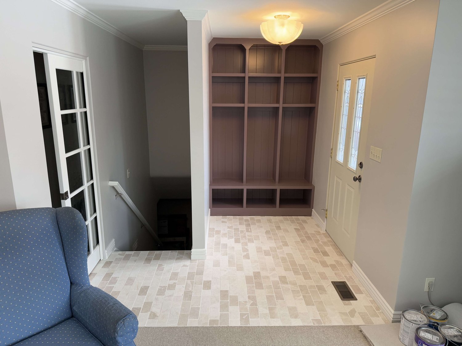 Entry with a built-in mudroom locker, new door, and trim in a Logan area home