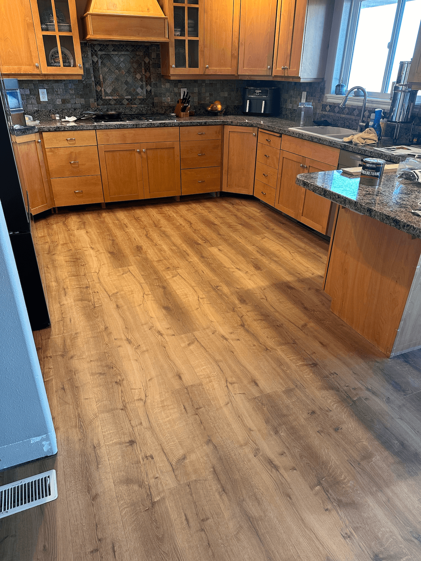 ONYX Bros flooring installers building out a floor in Logan, Utah