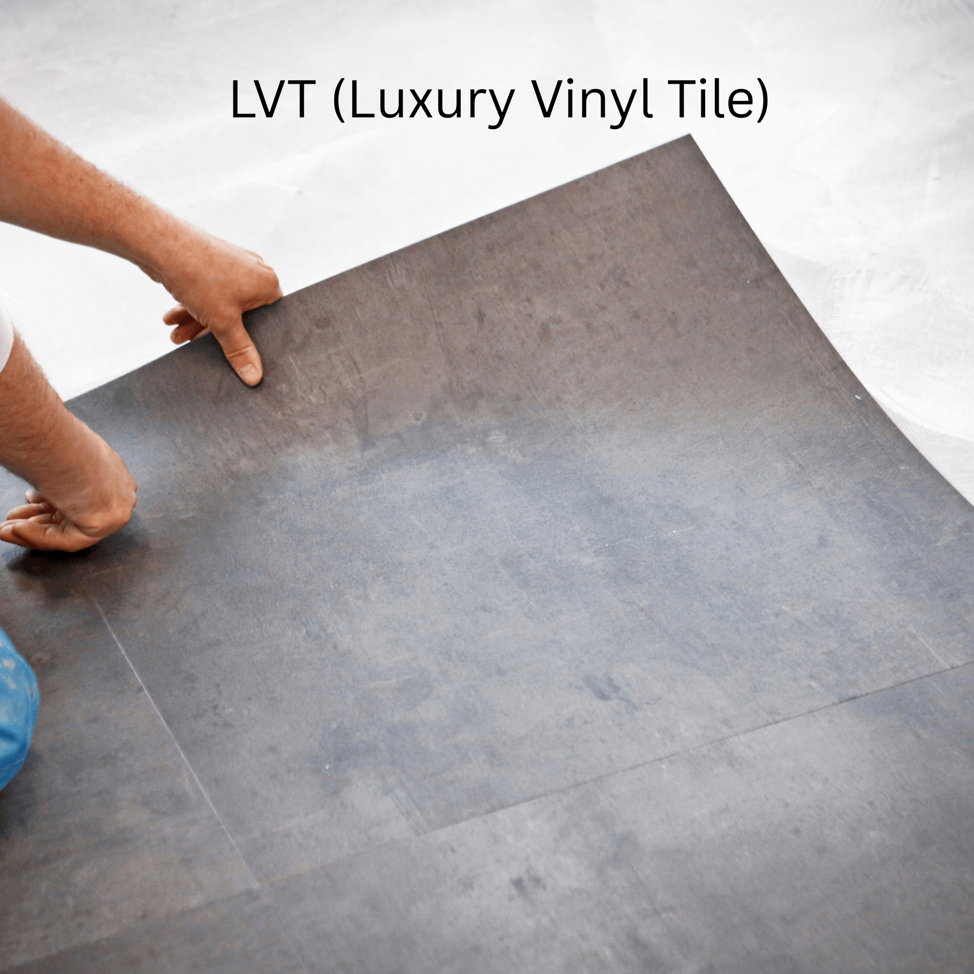 Person installing a large gray luxury vinyl tile on a floor.