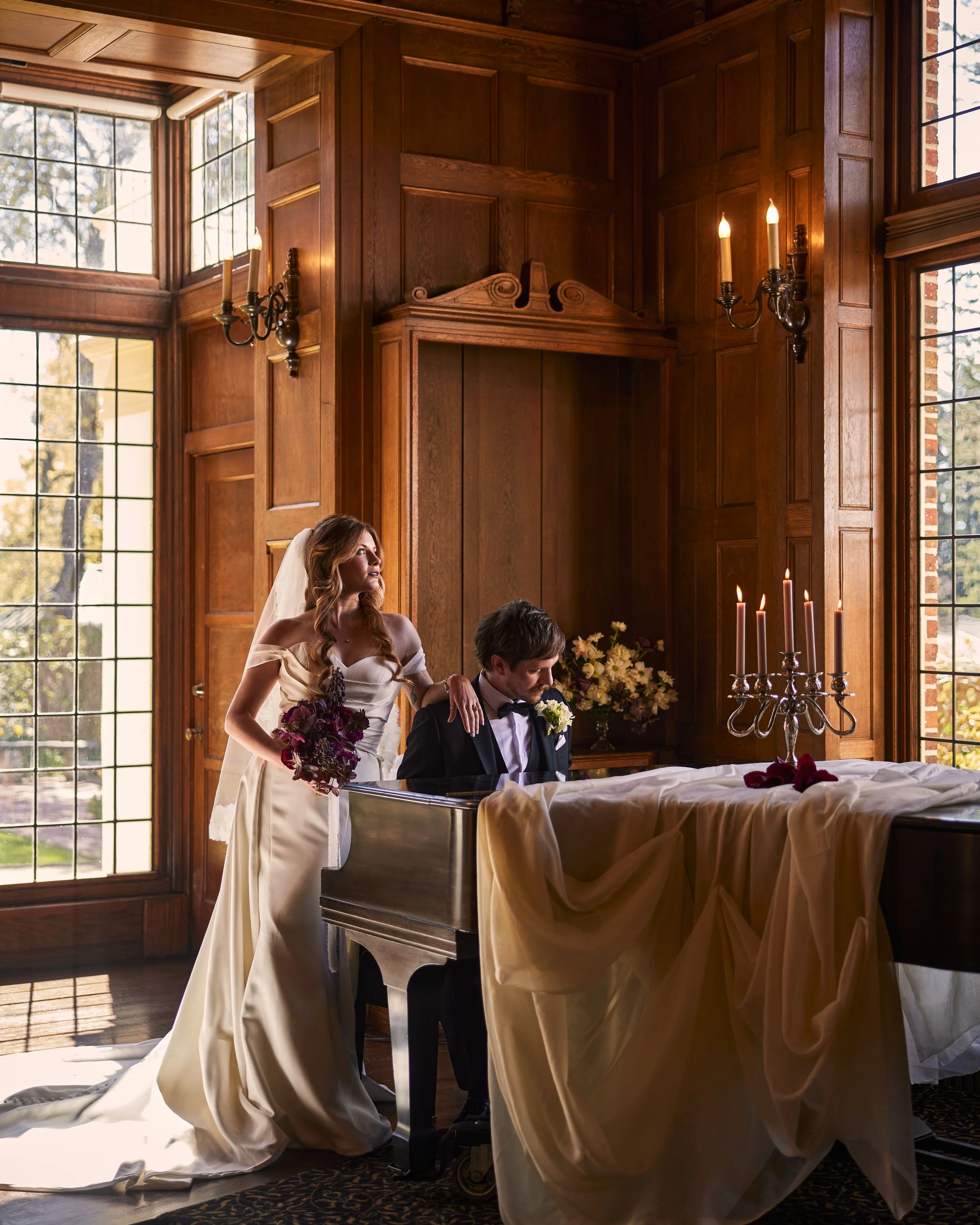 A  newlywed couple in Lairmont manor in Bellingham, WA playing the piano