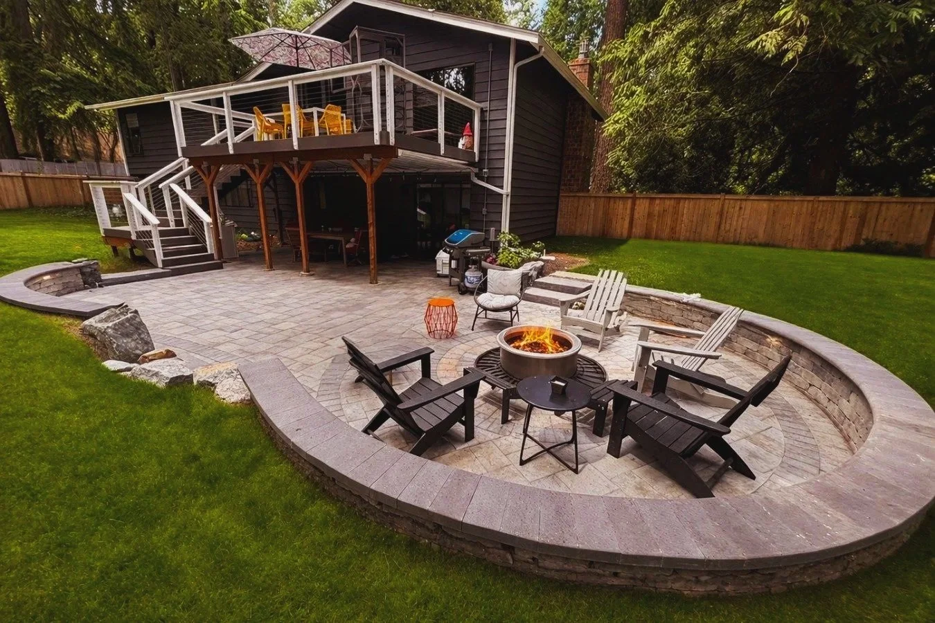 Backyard design with custom-built sunken paver patio built by the best landscaper in Snohomish Washington.