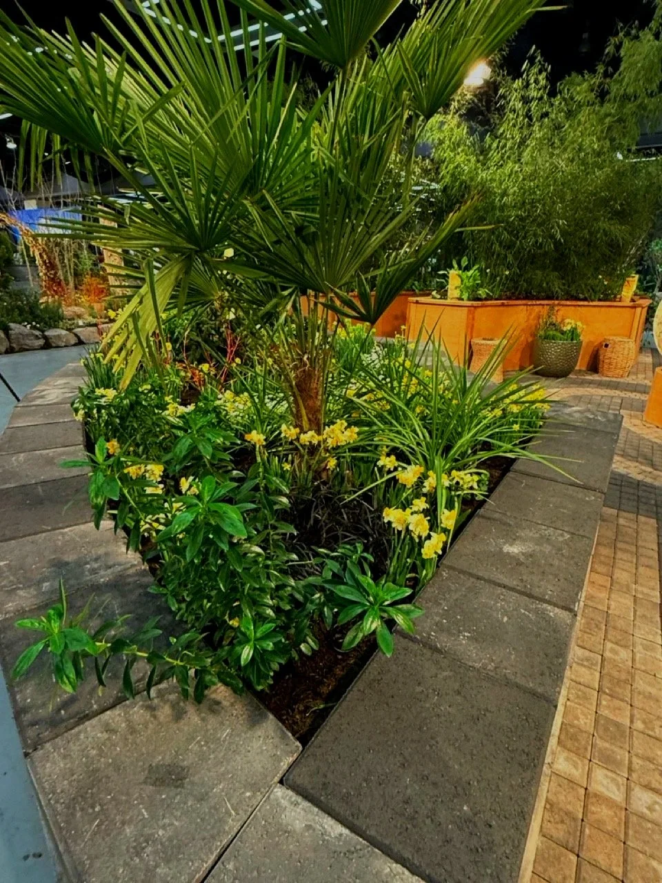 Green trees and plants as part of Seattle Garden expo landscape design.