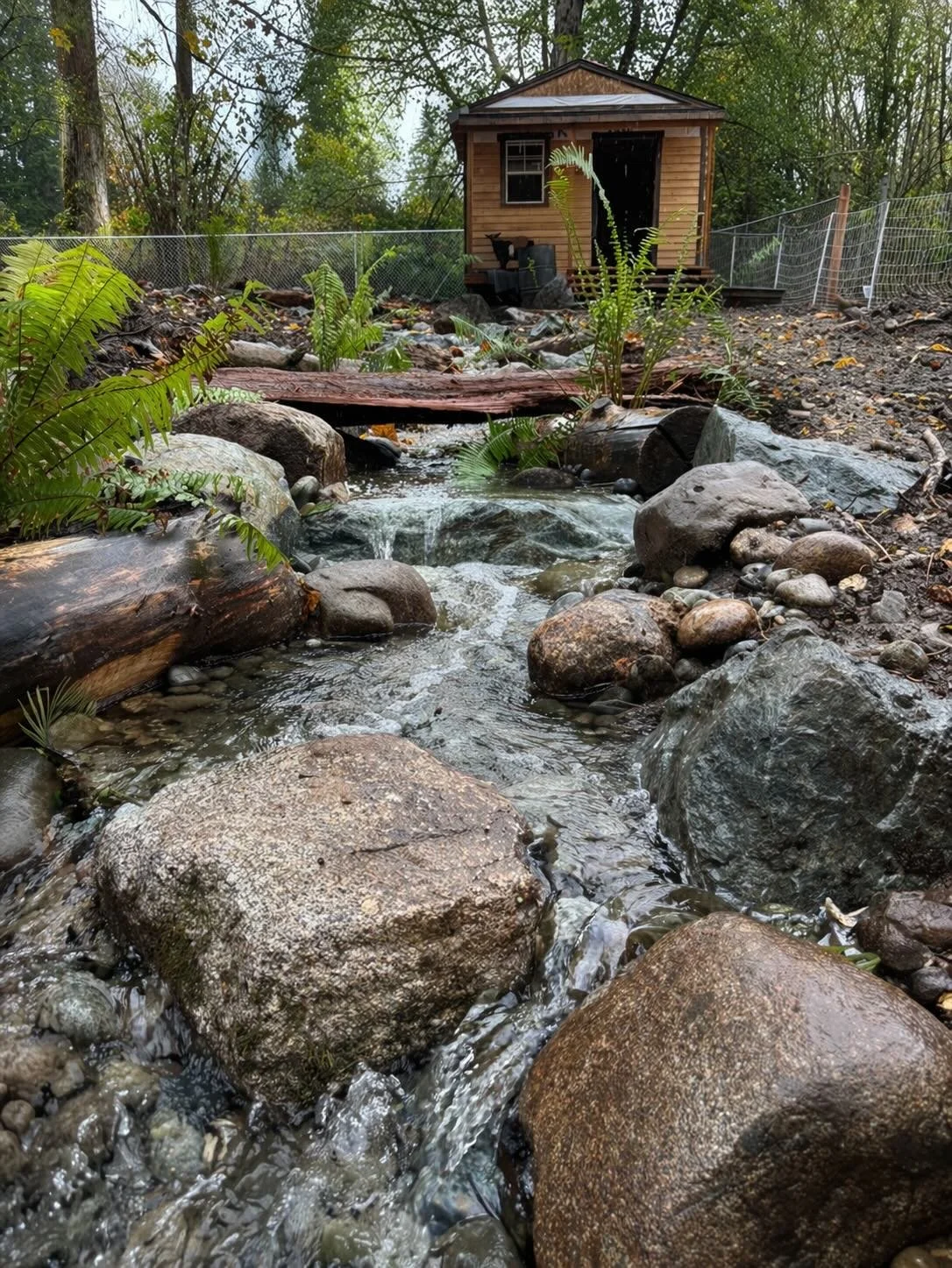 Cascading water feature built by the best landscape construction company near me.
