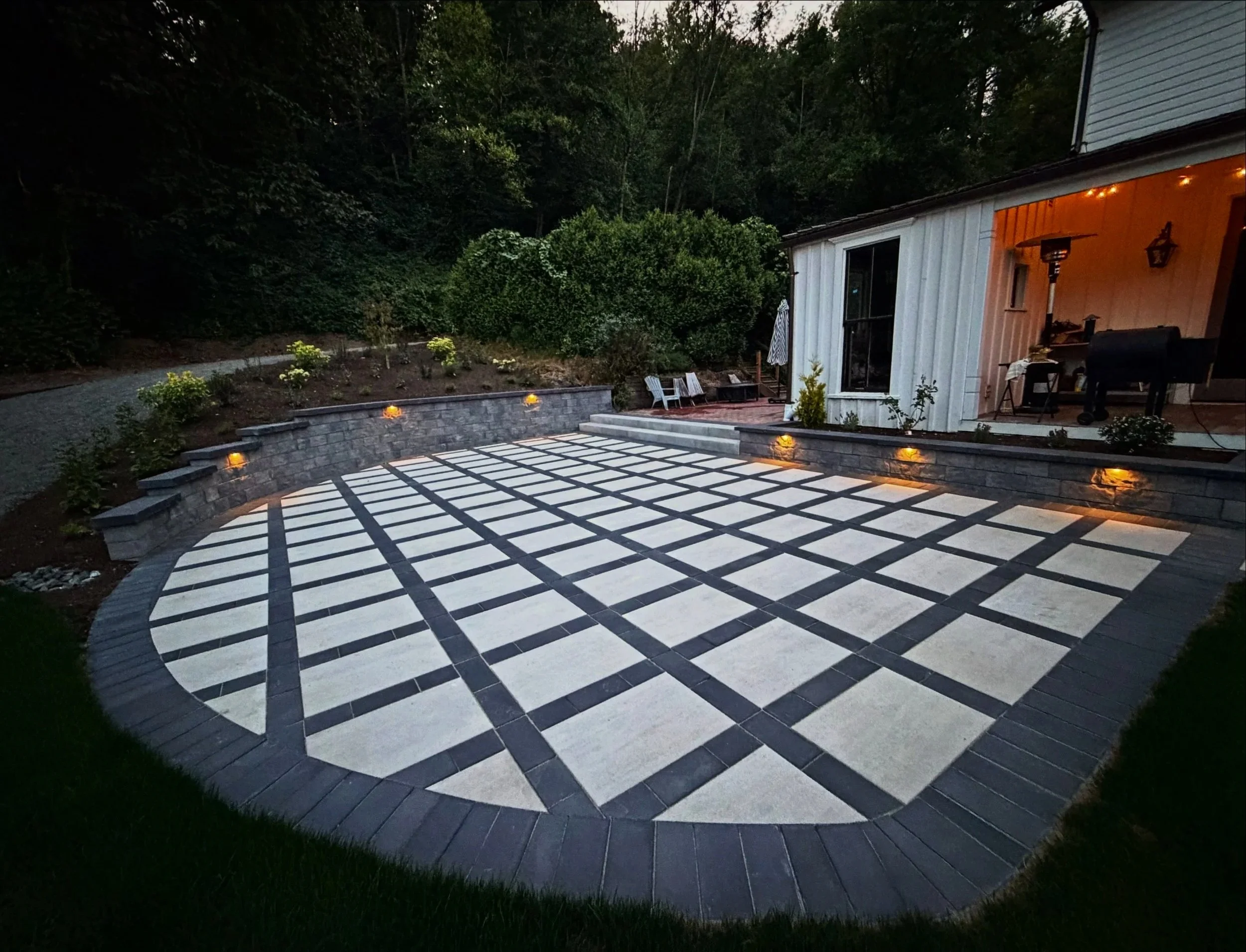 Premier hardscape and patio design services, featuring custom Techo-Bloc paver installation and retaining walls.