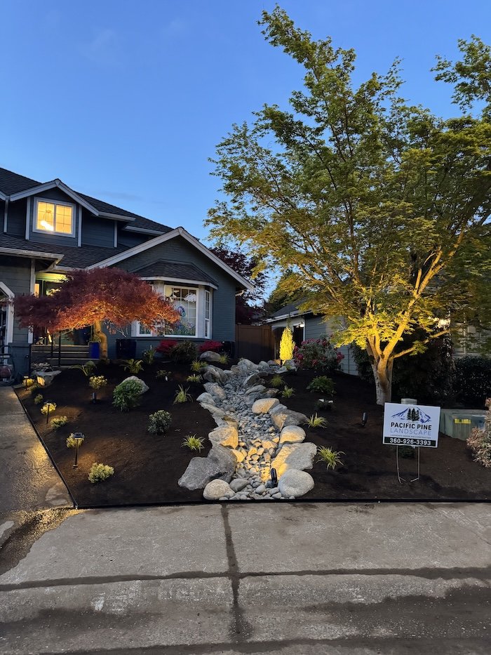 Beautiful front yard landscaping with landscaping lights built by a Snohomish Landscape company.