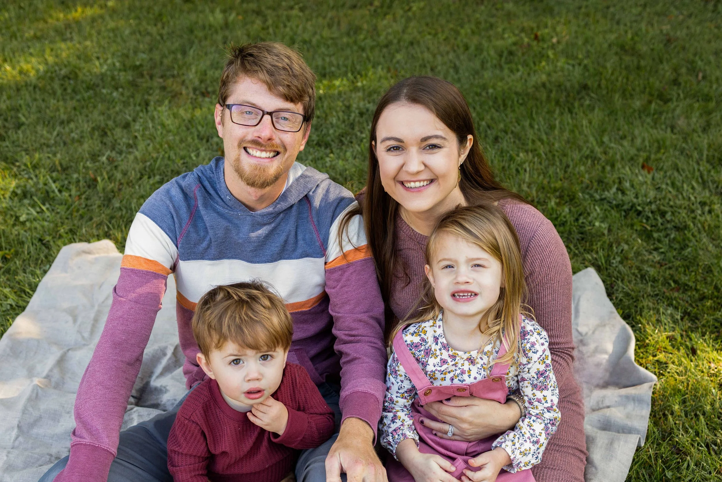 A young family sits on a blanket together - taken in Hunterdon County, NJ by Jennifer Fulton Photography